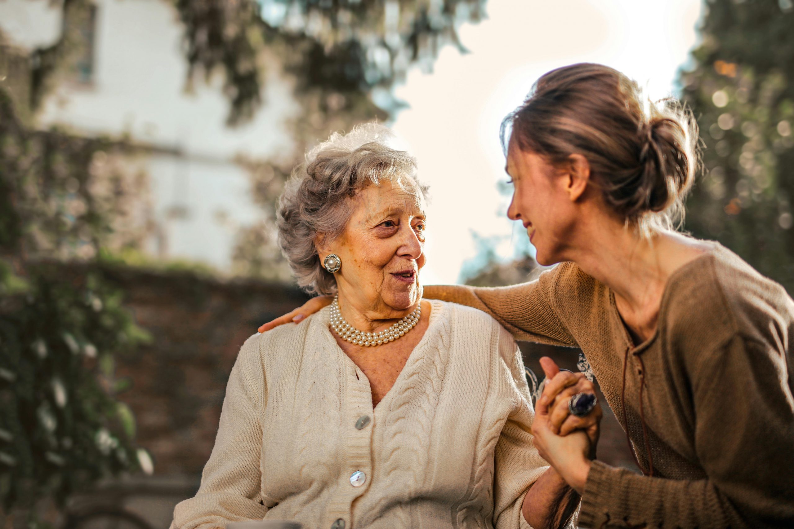 Adult mother and daughter smiling